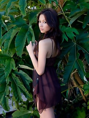 Slender and sexy gravure babe hanging at the beach in her bikini